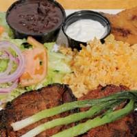 Grilled Marinated Pork Platter · Served with rice, beans, green salad, scallions, avocado, sweet plantains, sour cream and to...