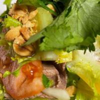 Beef Salad / Bò Tái Chanh · Rare beef salad mixed with lime juice. Topped with red onions, crunchy veggies, refreshing h...