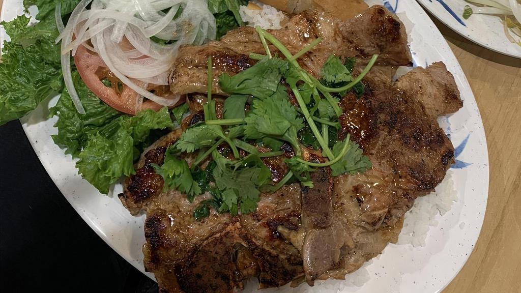 Grilled Pork Chop / Cơm Sườn Nướng · Highly Recommended Marinated grilled pork chop served with your choice of rice.