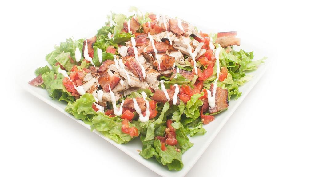 Chicken Blt Salad (Grilled Or Crispy) · Choice of grilled or crispy chicken with plum tomato and bacon served over a bed of romaine lettuce served with ranch dressing on the side.