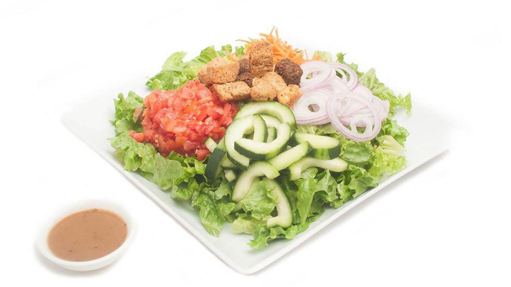 House Salad · Romaine lettuce with shredded carrots, cucumbers, plum tomato, red onion, and multigrain croutons served with balsamic vinaigrette on the side.