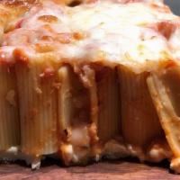 Deep Dish Rigatoni Pie · Stacked rigatoni smothered in ala vodka sauce and topped with melted mozzarella