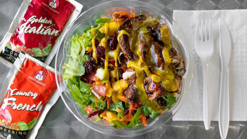 Jerk Chicken Salad · Salad with chicken that has been cooked in a spicy buttery sauce.