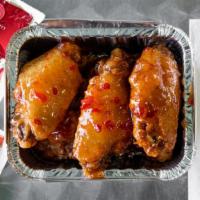 Sweet Chili Wings · Cooked wing of a chicken coated in sauce or seasoning.