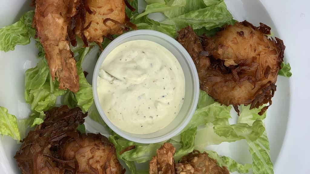 Coconut Shrimp · Butterflied jumbo shrimp rolled in coconut flakes lightly fried, served with tartar sauce.