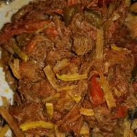 Ropa Vieja · Braised shredded steak with onions, bell peppers & plum tomatoes.