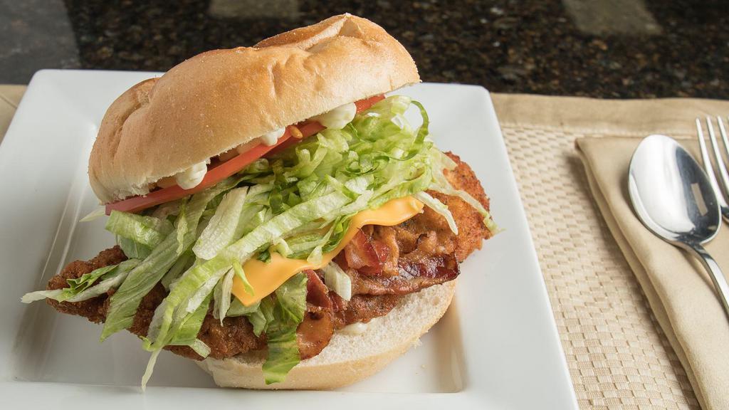 Chicken Cutlet Deluxe · Chicken cutlet, bacon, cheese, lettuce, tomato, mayo.