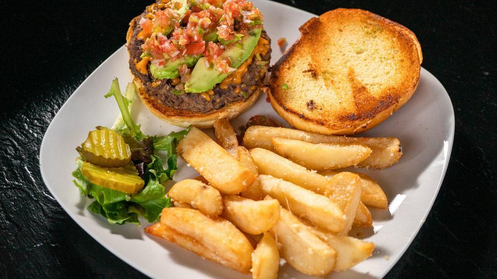 Block Bean Burger · Our house-made bean burger topped with pico, avocado, vegan cheddar, and micro cilantro on a toasted brioche bun.