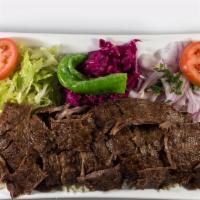 Lamb Gyro Plate · Doner. Fresh marinated lamb and beef on a rotating spit, then thinly sliced. Served with bul...