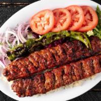 Adana Kebab Plate · Hand-chopped lamb with bell red peppers seasoned with unique herbs. Served with bulgur (crac...