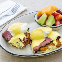 Goodman’S Benedict · New. Two poached eggs on potato latkes with pastrami and hollandaise sauce, served with fres...