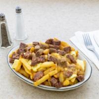 Poutine · New. French fries with melted cheddar cheese curds and brown gravy.