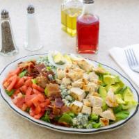 Goodman’S Cobb · New. Crisp romaine topped with grilled marinated chicken, bacon, bleu cheese crumbles, tomat...