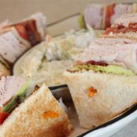 Turkey Club · With bacon, lettuce and tomato.
Comes dressed with Russian and Cole Slaw