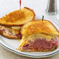 Reuben · Corned beef, pastrami or turkey on rye with Russian dressing, and sauerkraut, topped with me...