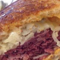 Reuben Combo · Corned beef, pastrami or turkey on rye with Russian dressing, and sauerkraut, topped with me...