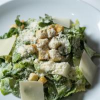Insalata Romana · Romaine lettuce, Caesar dressing and shaved parmesan cheese.