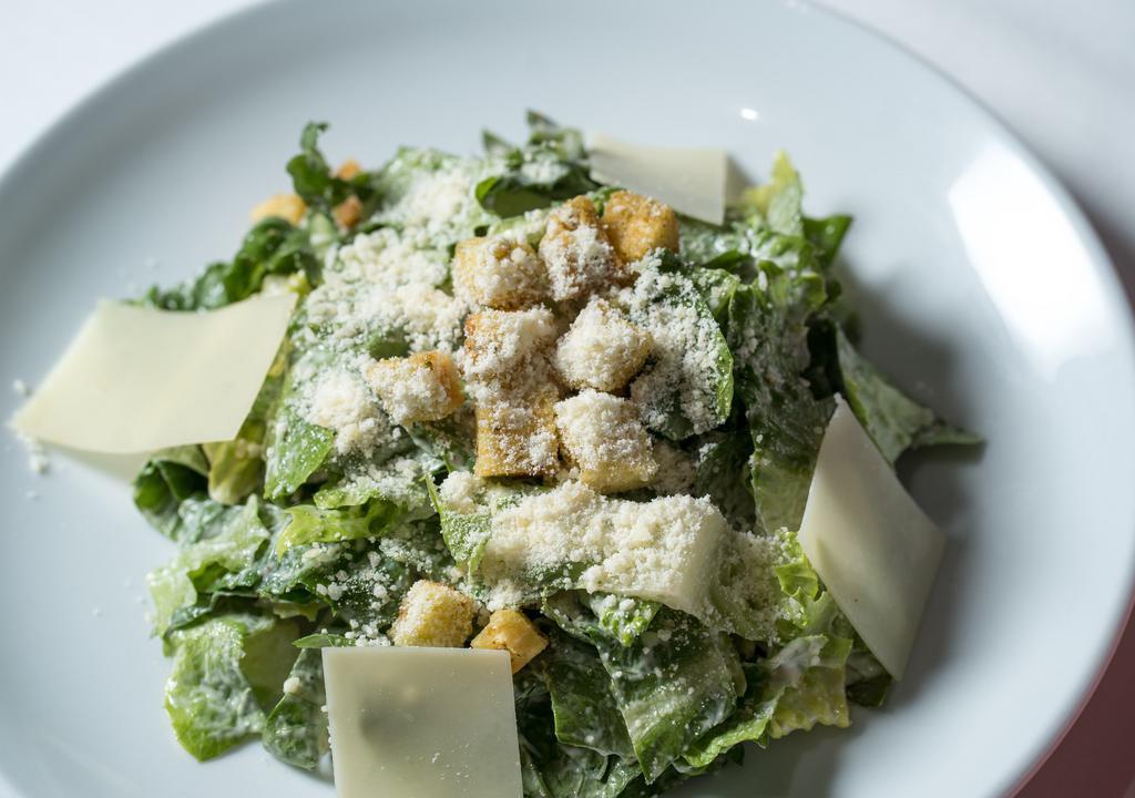 Insalata Romana · Romaine lettuce, Caesar dressing and shaved parmesan cheese.
