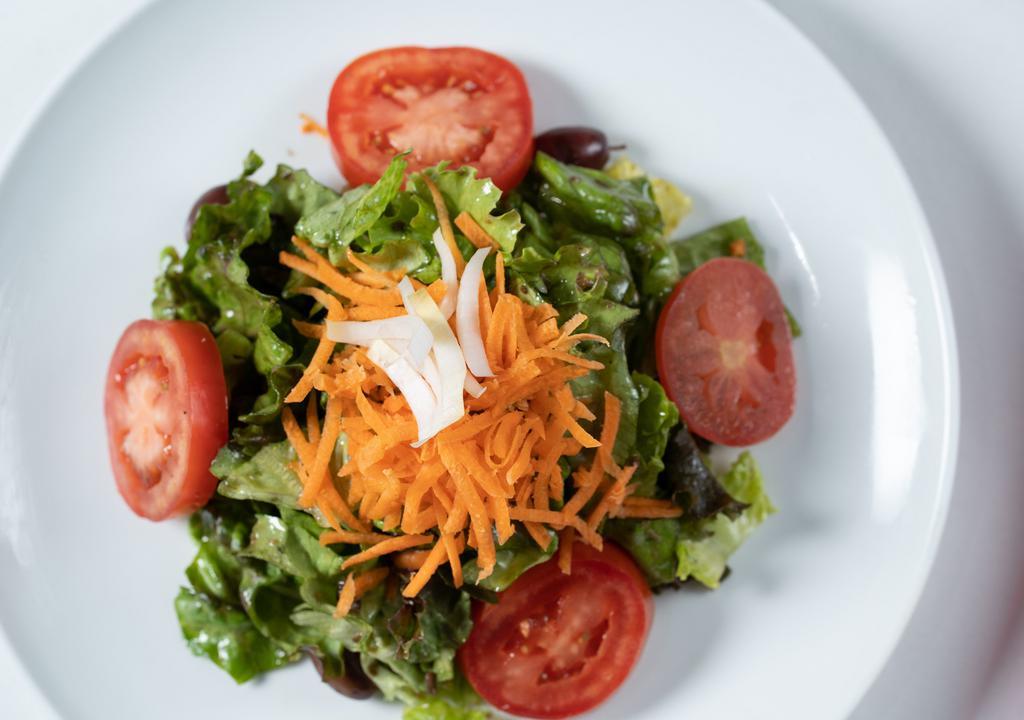 Insalata Mista · Mixed greens, tomatoes, carrots, olives, fine herbs, red wine vinegar and extra virgin olive oil.