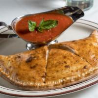 Calzone · Ricotta and mozzarella. Served with a side of marinara sauce.