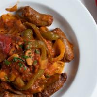Spaghetti With Sausage & Peppers · Hot and sweet Italian sausage, mushrooms, peppers, onions and tomato sauce.
