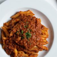 Penne Alla Bolognese · Penne and homemade zesty tomato meat sauce.