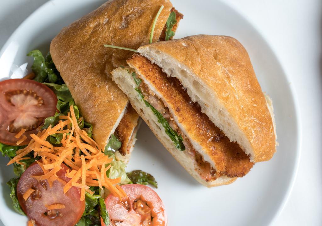 Panini Milanese Lunch Special · Breaded chicken cutlet, arugula, tomato and dressing.