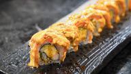 Spicy Salmon Roll · Mixed with spicy mayonnaise, masago, and crunch. Spicy.