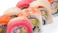 Rainbow · California roll topped with five kinds of fish and avocado.