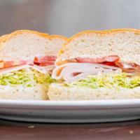 Turkey Sandwich · Served with lettuce, tomato and mayo.