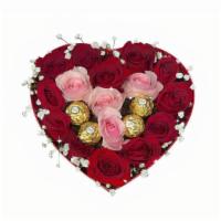 Precious Heart · Pink and red roses and chocolates arranged in a heart shaped can.