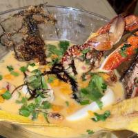 Leche De Tigre / Ceviche Sauce · Hecho con: pescado corvina picado, mejillones, calamares, vieiras, pulpo, camarones, cebolla...