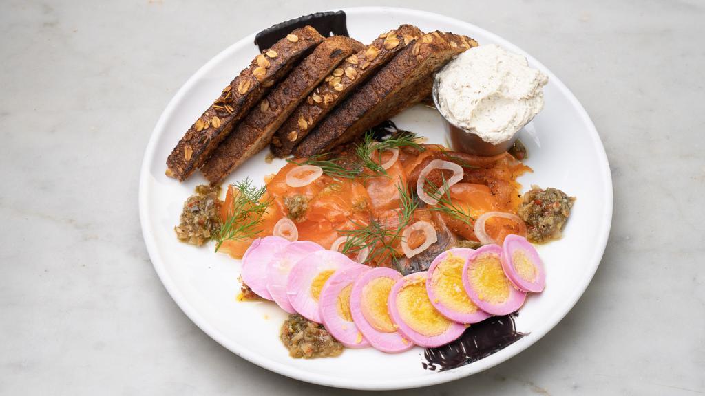 House-Cured Norwegian Salmon · Toasted caper & roasted garlic cream cheese, house-pickled relish, hard-boiled egg, red onion & dill. Choice of 7-grain or hash browns