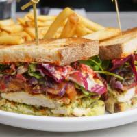Grilled Chicken Sandwich · bacon, avocado, calabrian chilis, arugula, heirloom tomatoes, grilled onions, toasted sourdo...