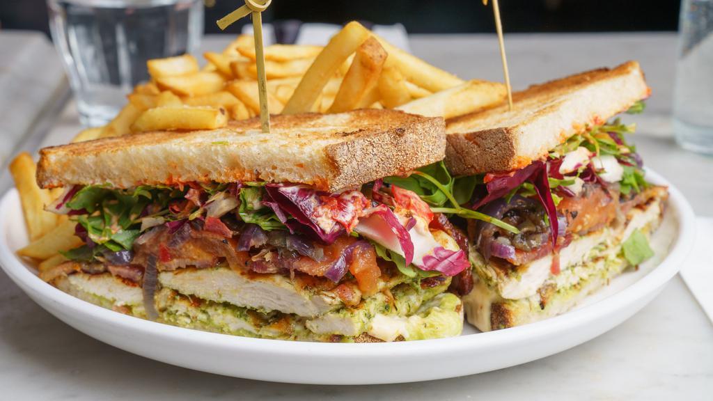 Grilled Chicken Sandwich · bacon, avocado, calabrian chilis, arugula, heirloom tomatoes, grilled onions, toasted sourdough