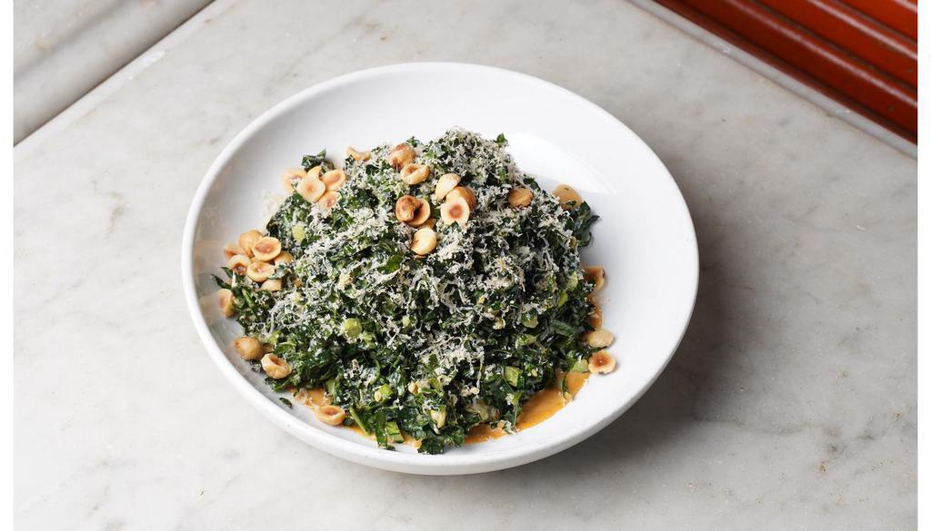 Black Kale Salad · Aged gouda, toasted hazelnuts, garlic croutons & spicy anchovy dressing.