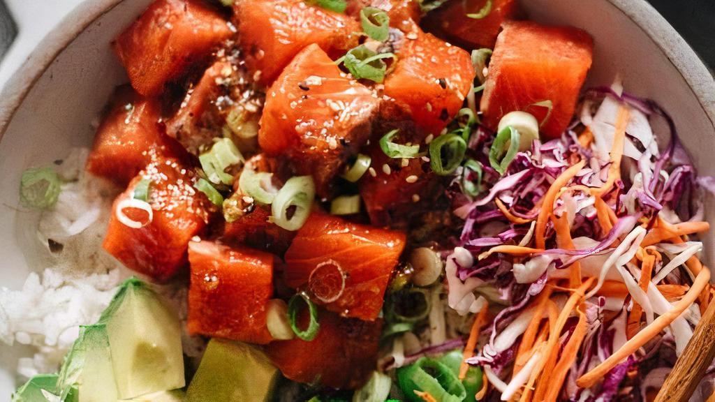 Yuzu Ponzu Salmon Poke · atlantic salmon,  cucumber, sweet onion,pineapple, cilantro, seaweed salad, green onion, sesame seed, onino crisp, fresh ponzu sauce, lettuce