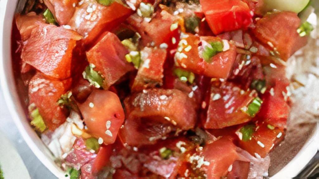 Spicy Ahi Tuna Poke · ahi tuna, cucumber, sweet onion, edamame, shiracha sauce, masago, seaweed salad, reen onion, sesame seed, onino crisp, shredded nori, lettuce
