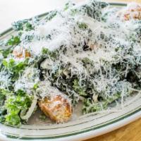 Kale Caesar Salad · Black kale, garlic croutons, and parmesan dressing.