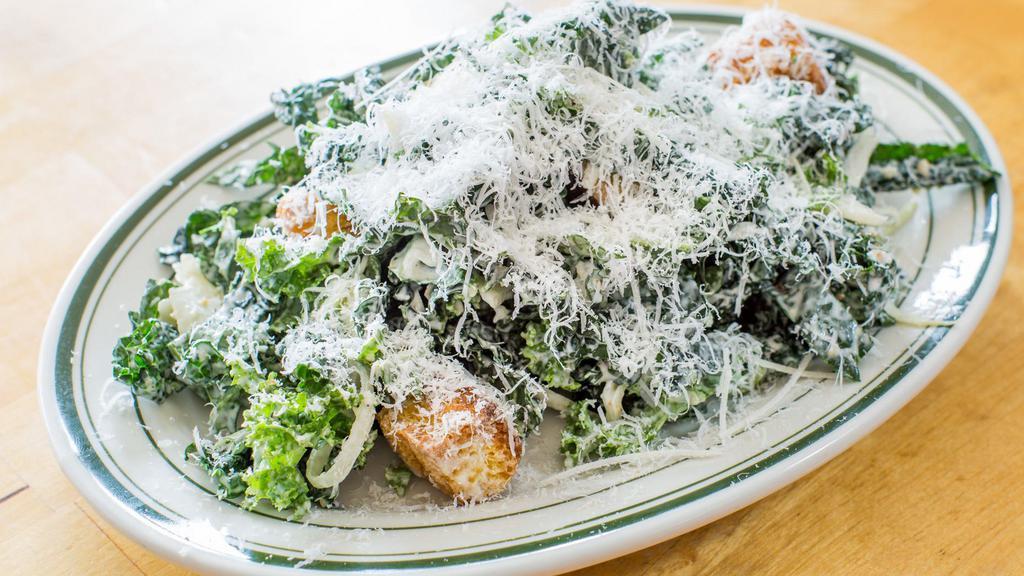 Kale Caesar Salad · Croutons with Parmesan-garlic dressing.