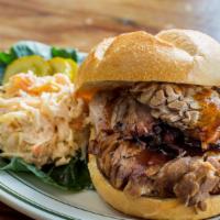 Brisket Sandwich · Slow smoked brisket, Joint Smoke BBQ sauce. Served with salad and slaw.