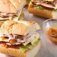 Honey Turkey Sandwich On Roll · With cheese, lettuce and tomatoes.