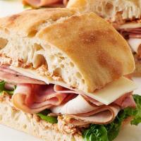 Turkey Sandwich On Roll · With cheese, lettuce and tomatoes.