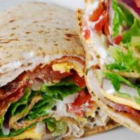 Turkey Club Wrap · Turkey, bacon, cheese, lettuce and tomatoes.
