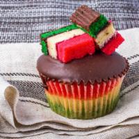 Over The Italian Rainbow · Green, Yellow & red layered almond cake dipped in chocolate ganache and topped with two Ital...