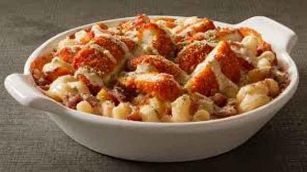 Buffalo Chicken Mac · Crispy chicken tossed in buffalo sauce on top of noodles with housemade cheese sauce.
