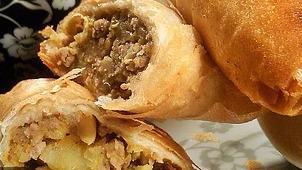 Meat Samosa · Triangular patties with seasoned ground beef (two in one order).