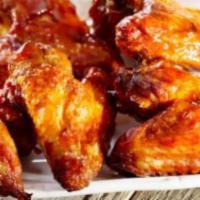 Chicken Wings · Wings cooked in barbecue sauce and seasoning.