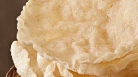 Papadum · Crisp, and fried spicy lentil wafers (two in one order).