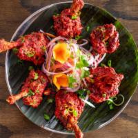 Chicken Lollipop
 · Well marinated chicken wings deep fried sauteed with our lollipop sauce.